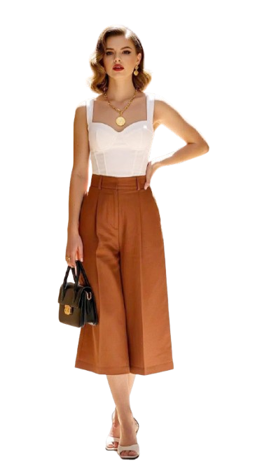 Woman wearing a cream two-piece outfit with floral embroidery and matching accessories.